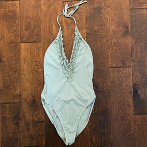 Green V-neck bodysuit